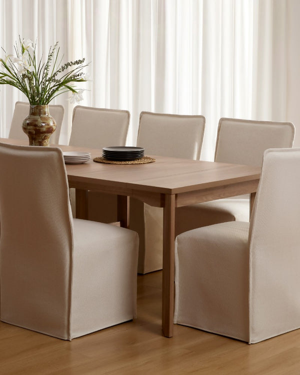 Lifestyle image of a 15-inch back dining chair in eggshell fabric highlighting the washable dining chair collection.