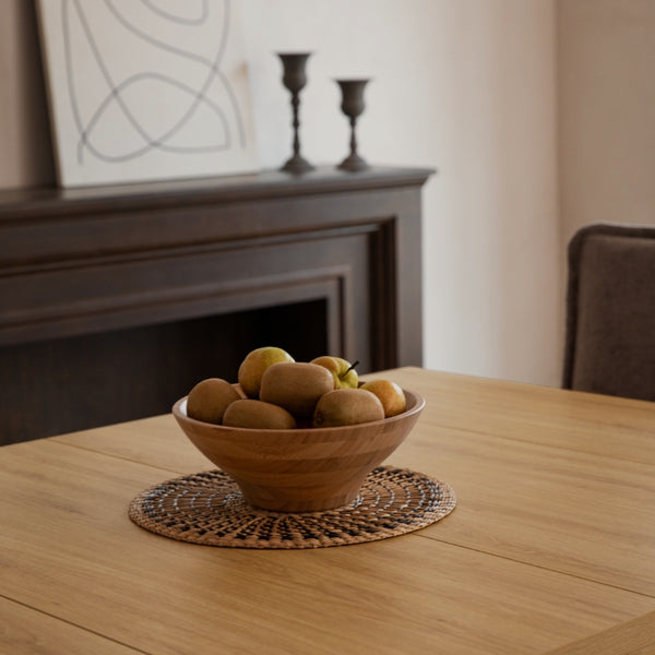Close up of a oak extendable wood dining table with bowl of fruit on top