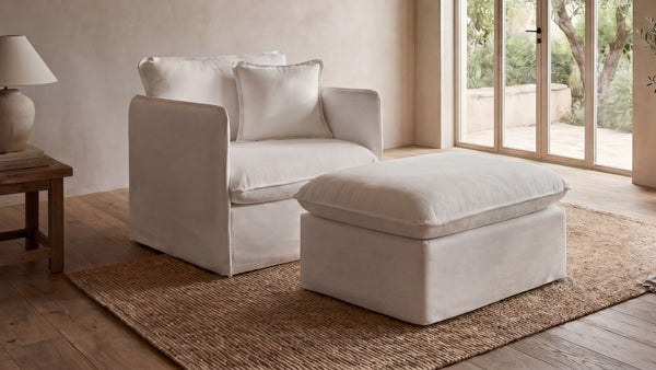 Lifestyle image of a modular armchair with ottoman in Eggshell fabric highlighting customizable modular seating configurations.