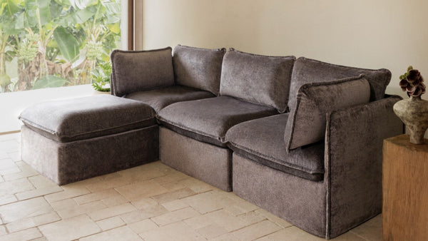 Lifestyle image of a modular 3-seater sectional in Caviar fabric highlighting removable machine-washable slipcovers.