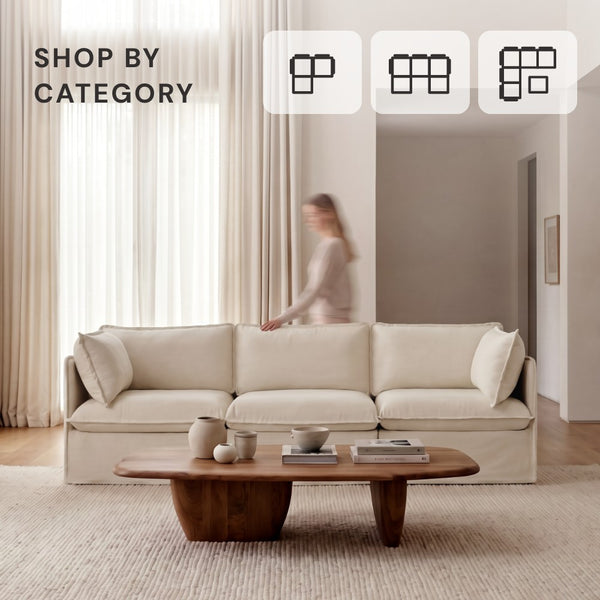 Lifestyle image of a 3-seater modular sectional in white fabric styled in a modern living room.