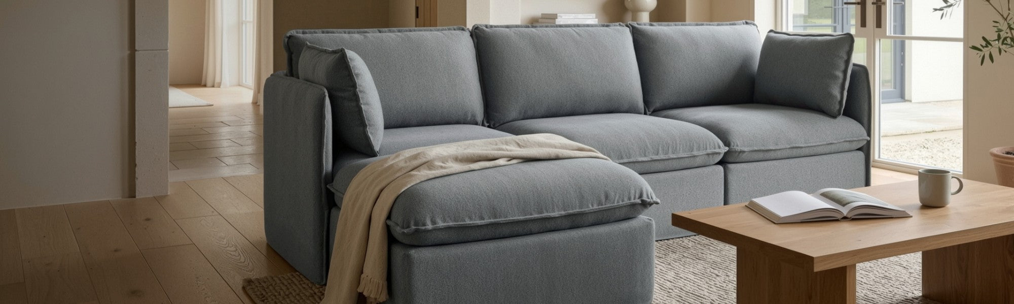 Lifestyle banner image of a modular 3-seater sectional sofa in Ash fabric styled in a real home setting, highlighting a 30-day risk-free trial.