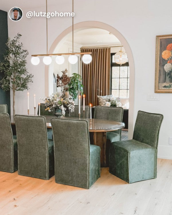 Lifestyle image of 8 Washable Upholstered Dining Chairs (19” back height) in Willow fabric, shown in a real customer home dining space.