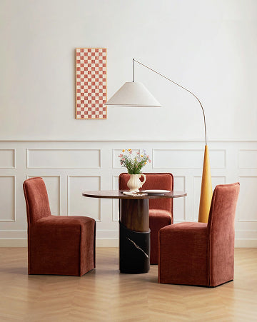 Lifestyle image of a 15-inch back dining chair in Rust fabric highlighting the washable dining chair collection.